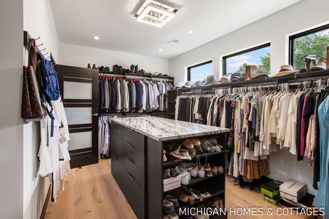 spacious closet featuring light wood-type flooring