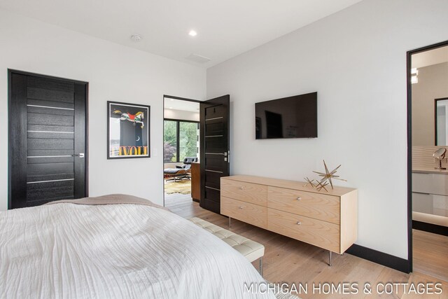 bedroom featuring light hardwood / wood-style floors