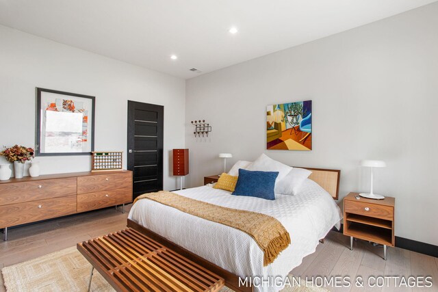 bedroom featuring wood-type flooring