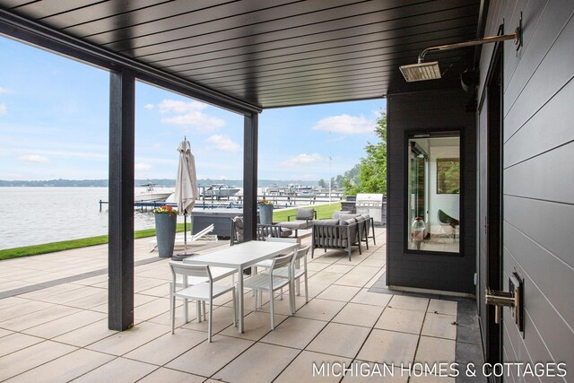 view of patio / terrace featuring an outdoor hangout area and a water view