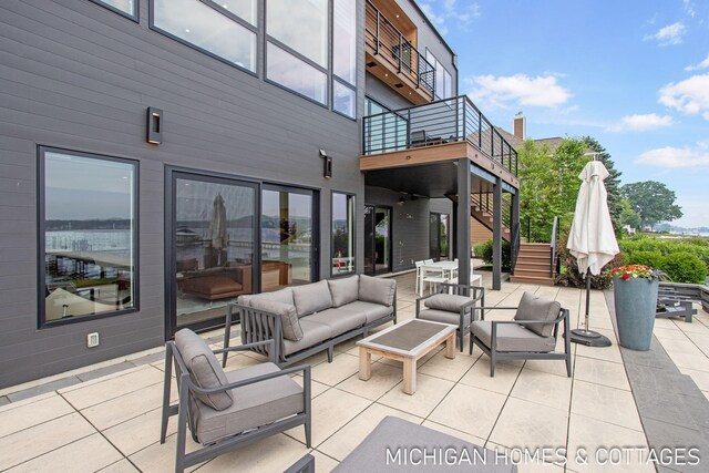 view of patio with a balcony and an outdoor hangout area