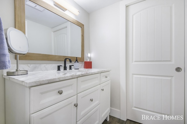 bathroom featuring vanity and wood-type flooring