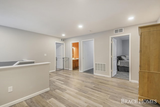 spare room featuring light hardwood / wood-style floors