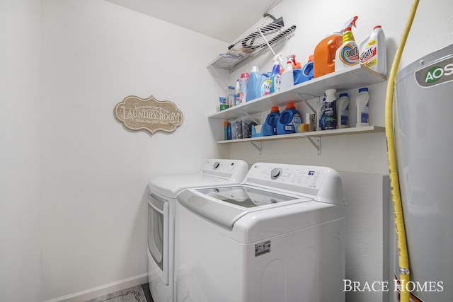 clothes washing area featuring washer and dryer