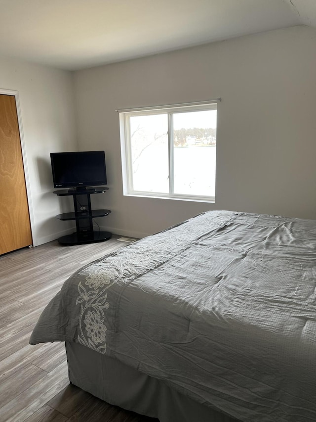 bedroom featuring light hardwood / wood-style floors