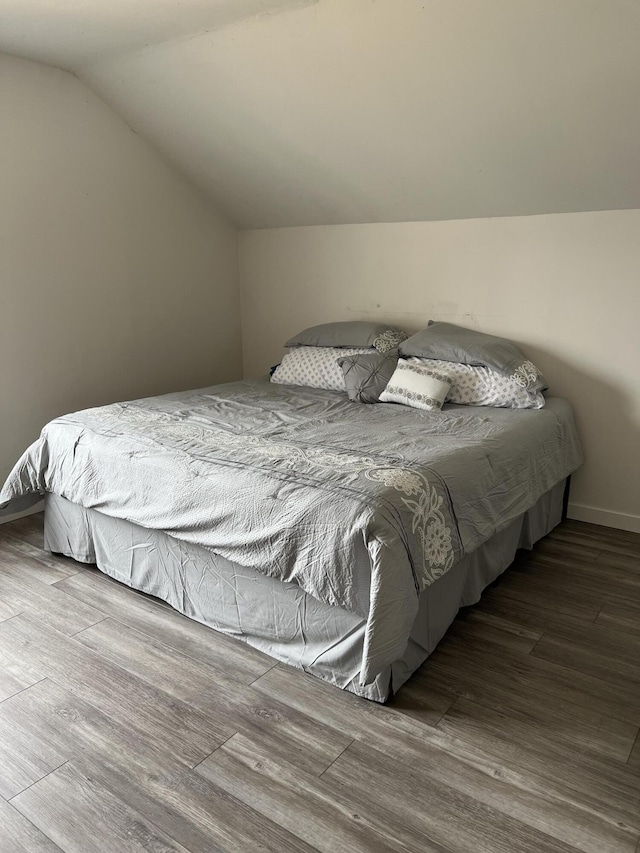 bedroom featuring vaulted ceiling