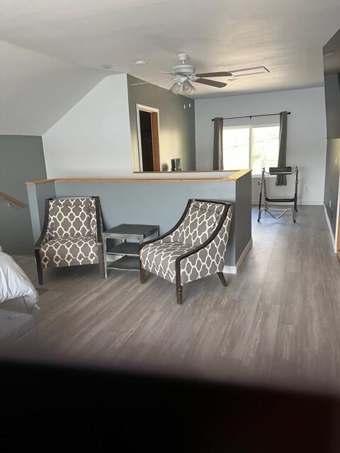 interior space with hardwood / wood-style floors and ceiling fan