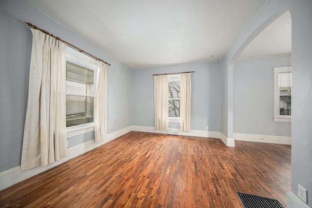 spare room featuring dark hardwood / wood-style flooring