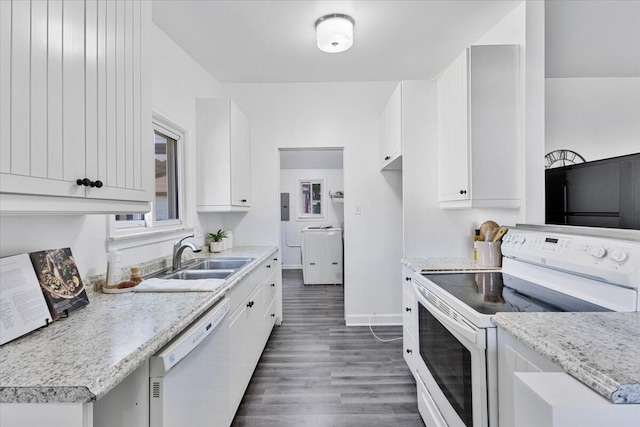 kitchen with white appliances, white cabinets, sink, dark hardwood / wood-style floors, and washer / clothes dryer