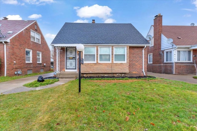 bungalow-style house with a front yard