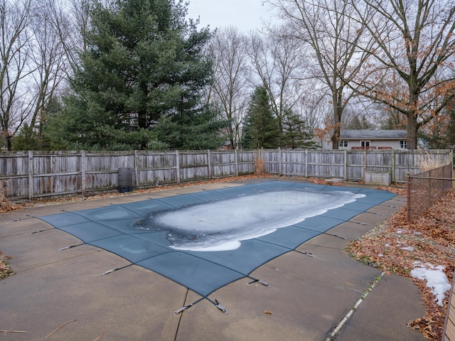 view of pool with a patio and a fenced backyard