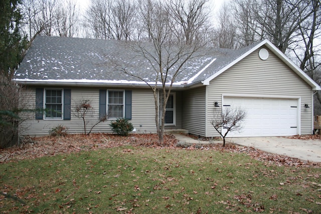 ranch-style house with a front yard and a garage