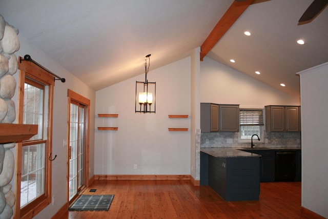 kitchen with dishwasher, lofted ceiling with beams, tasteful backsplash, wood-type flooring, and sink