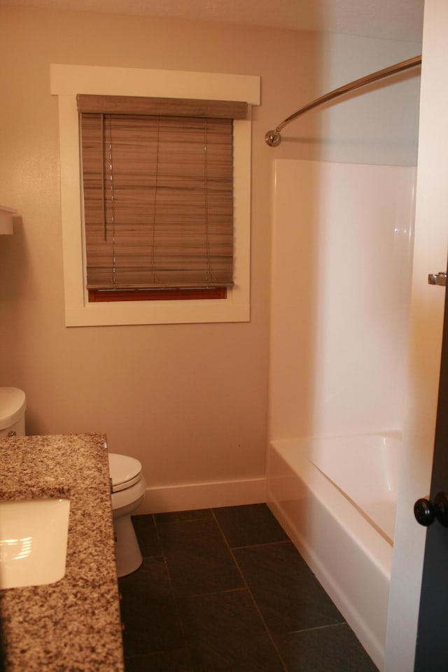 full bathroom with toilet, tile patterned floors, sink, and tub / shower combination