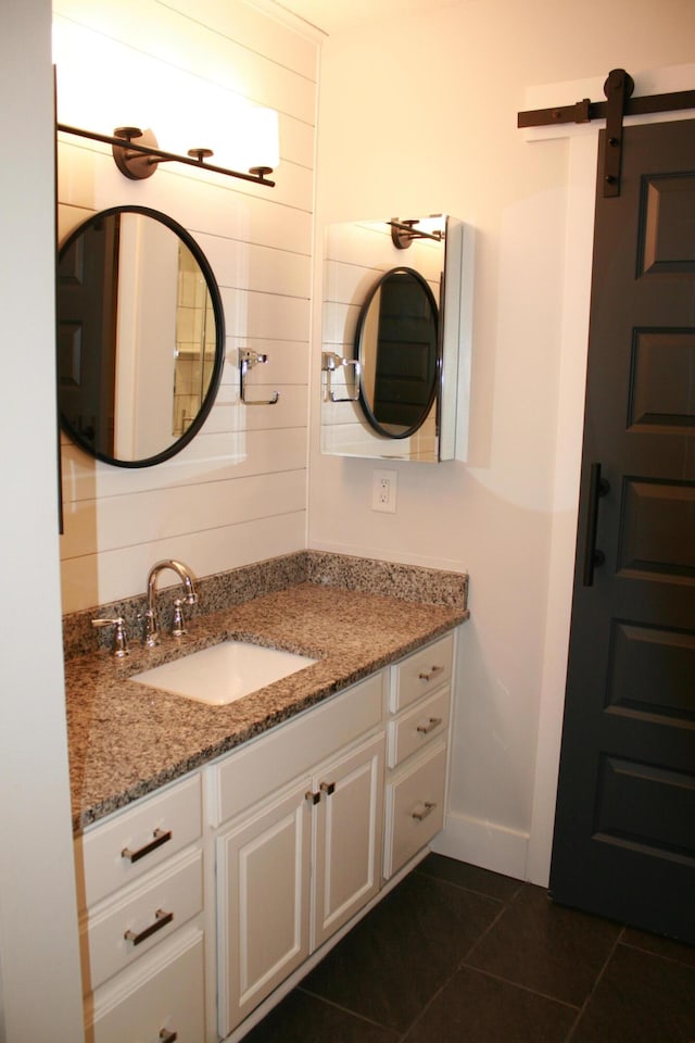 bathroom with vanity and tile patterned floors