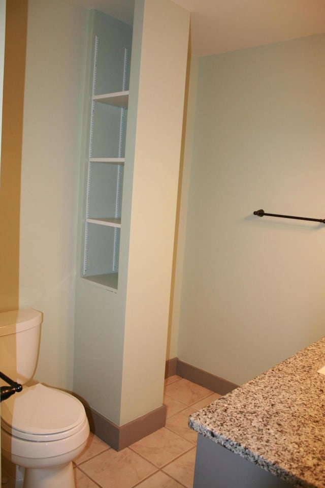 bathroom featuring toilet and tile patterned floors