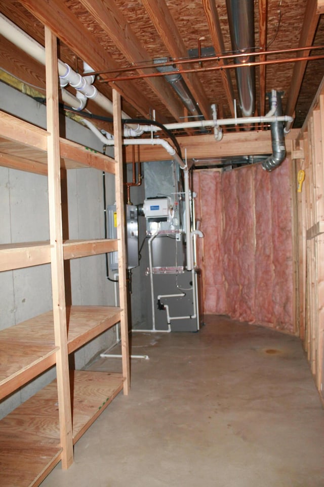 basement featuring water heater