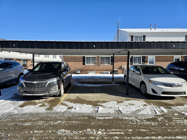 view of snow covered parking