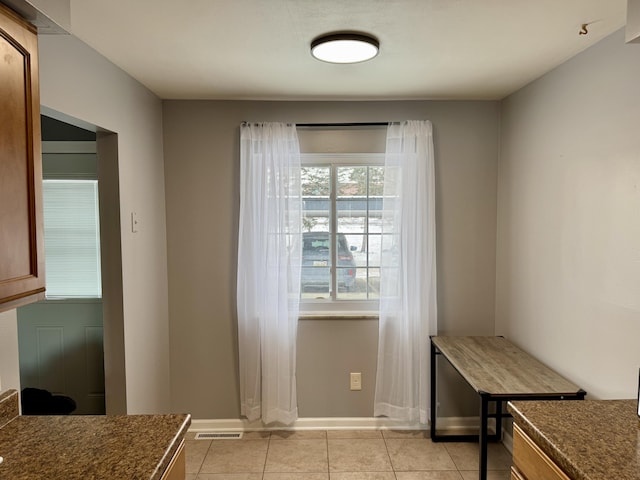 interior space with light tile patterned floors