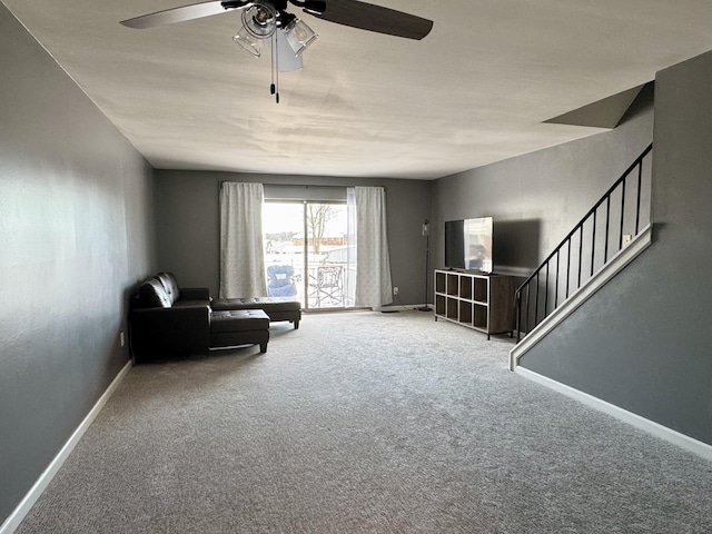 unfurnished room with ceiling fan and carpet floors