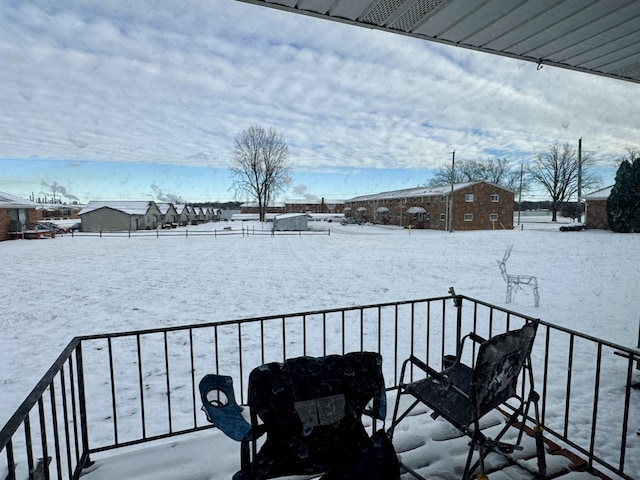 view of yard layered in snow