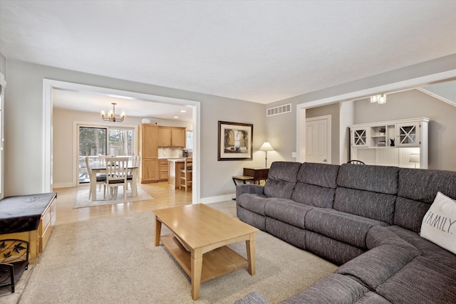 living room featuring a notable chandelier