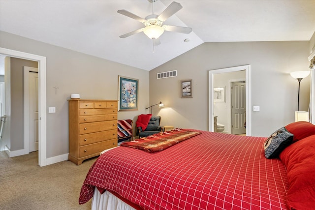 bedroom featuring connected bathroom, ceiling fan, light carpet, and vaulted ceiling