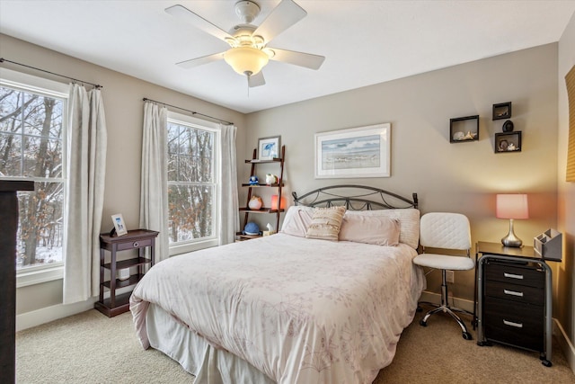 bedroom featuring ceiling fan and light colored carpet