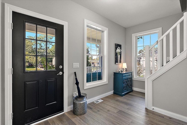 foyer entrance with hardwood / wood-style floors