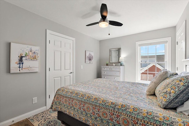 bedroom featuring hardwood / wood-style flooring and ceiling fan