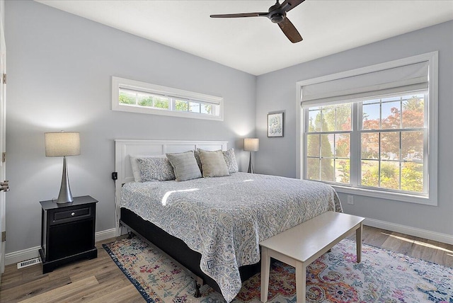 bedroom with ceiling fan and light hardwood / wood-style flooring