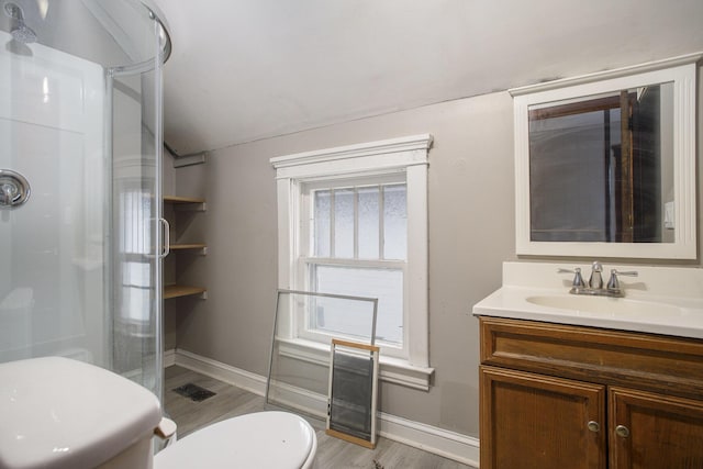 bathroom featuring vanity, an enclosed shower, hardwood / wood-style floors, and toilet