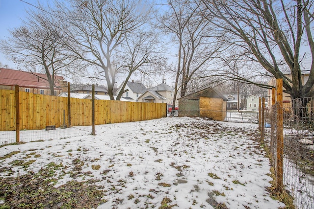 view of yard covered in snow