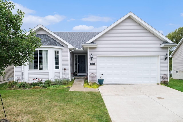 single story home featuring a garage and a front lawn