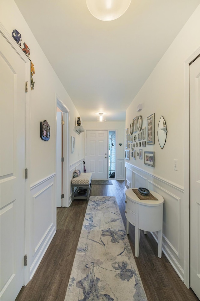 hall with dark hardwood / wood-style floors