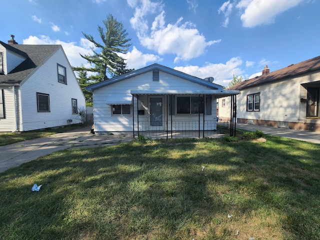 bungalow-style house with a front yard