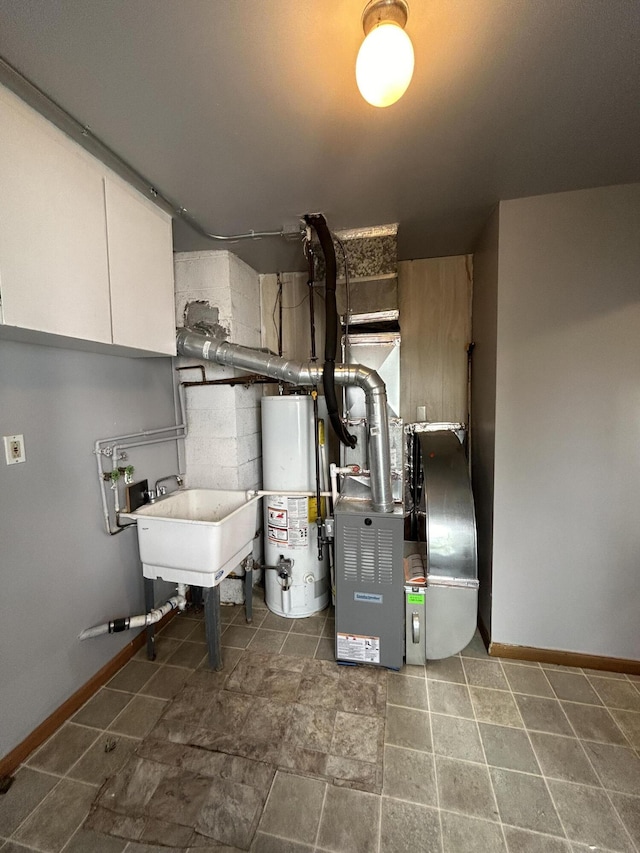 utilities featuring gas water heater and sink