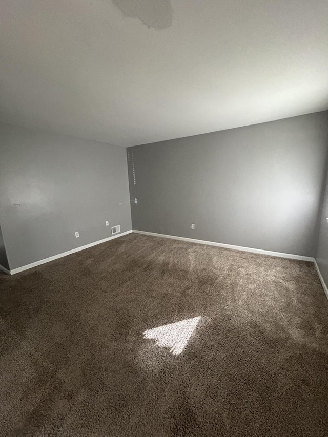 spare room featuring carpet flooring