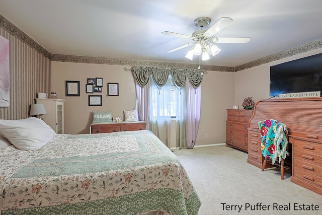 bedroom featuring ceiling fan and carpet floors