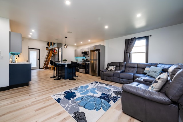 living room with light hardwood / wood-style flooring