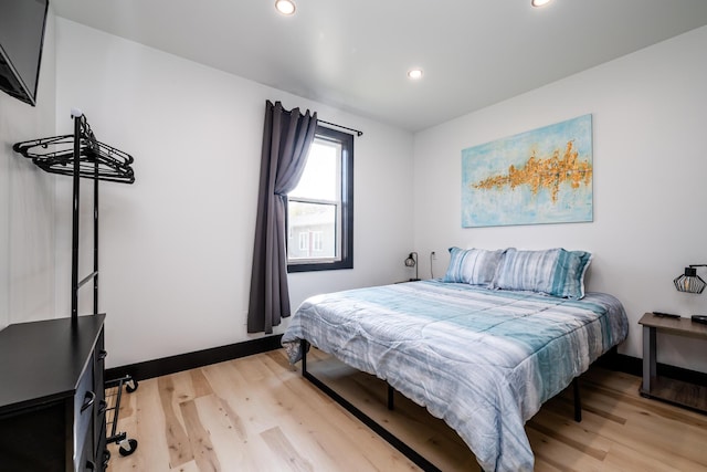 bedroom with light wood-type flooring