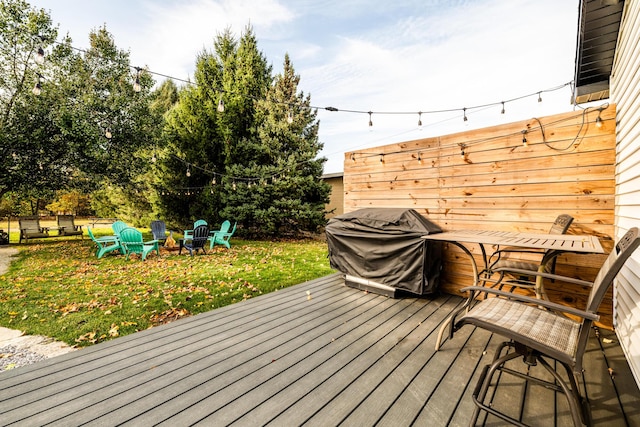 wooden deck with grilling area