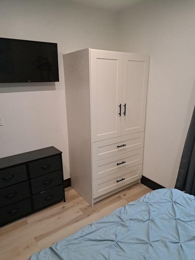 bedroom with light wood-type flooring