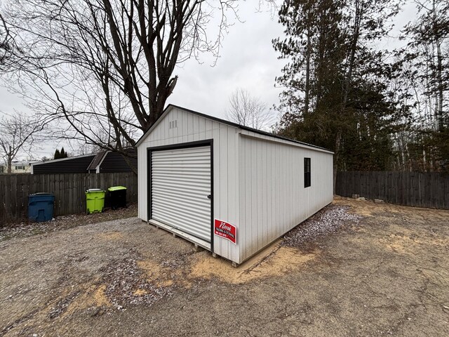 view of outbuilding with a garage