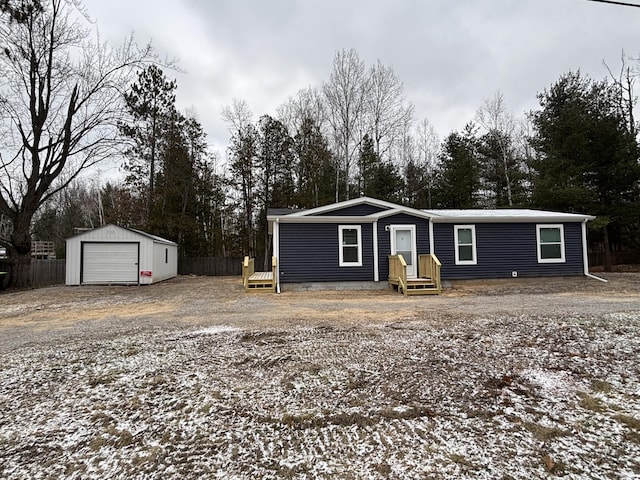 view of front of home featuring an outbuilding and a garage