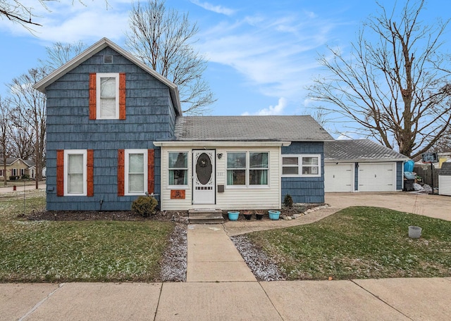 view of front of home with a front yard and a garage