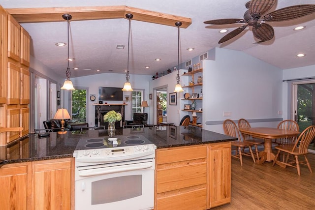 kitchen with decorative light fixtures, white range with electric cooktop, ceiling fan, and lofted ceiling