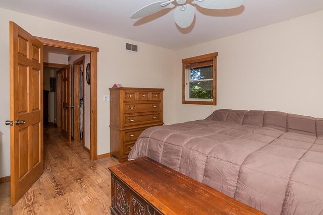 bedroom with ceiling fan and light wood-type flooring