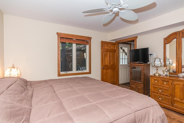 bedroom with ceiling fan and hardwood / wood-style flooring