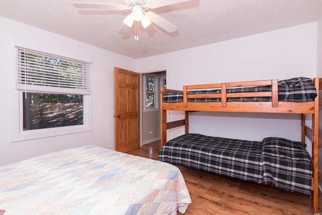 bedroom featuring hardwood / wood-style floors and ceiling fan